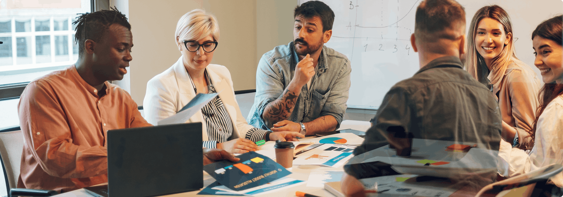 Image showing a diverse group of people working on a table in an office